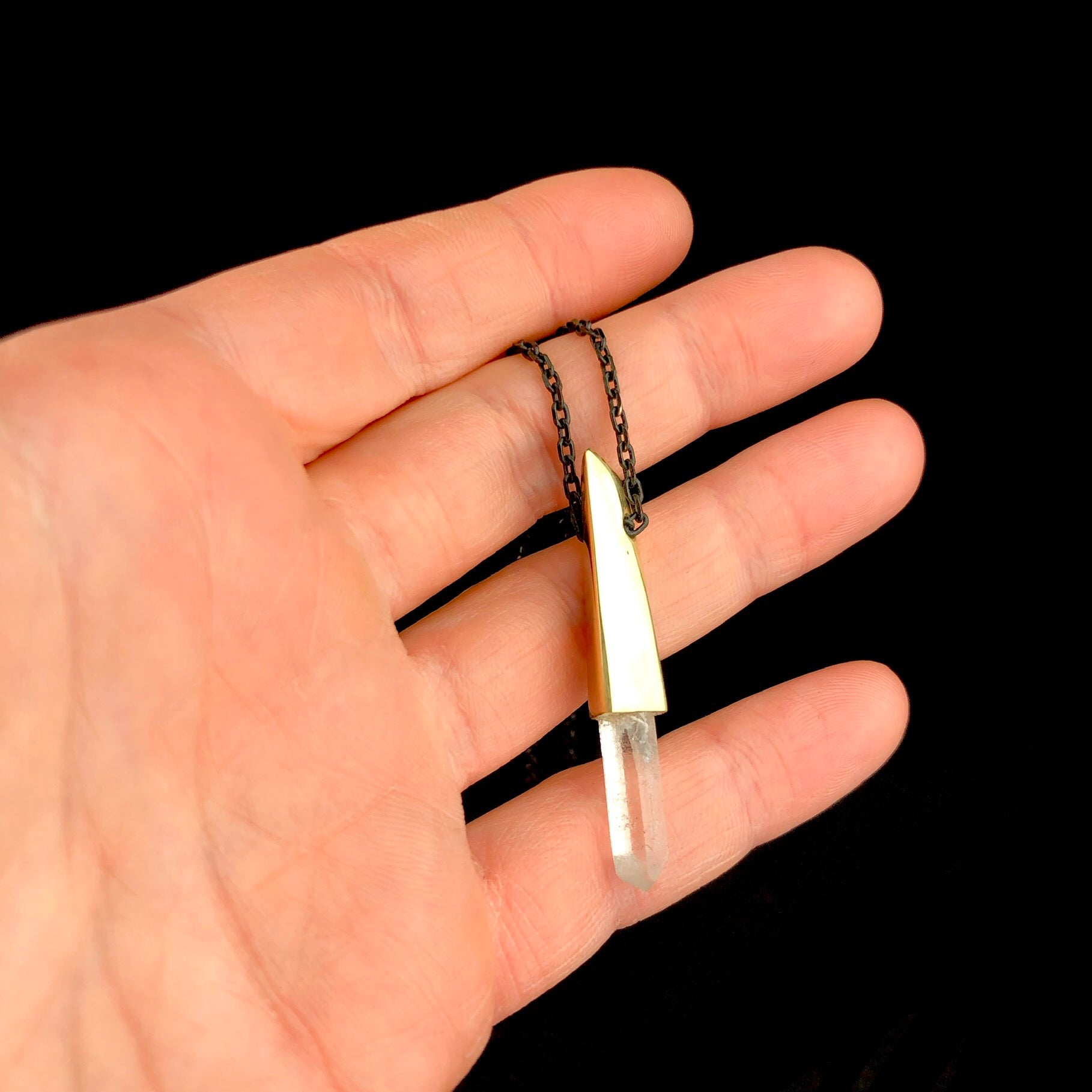 Clear Quartz Pendant Shown in Hand