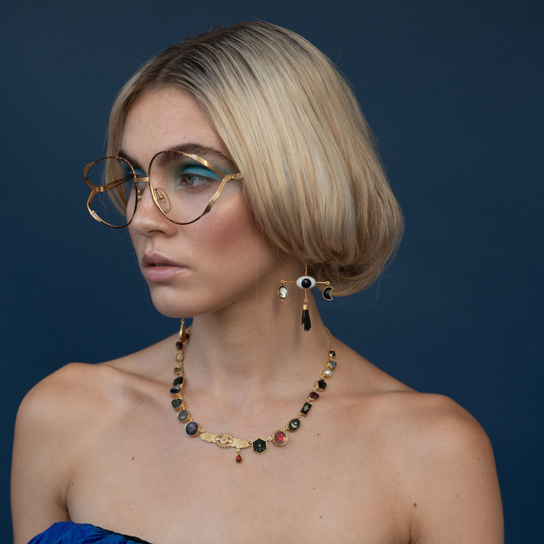 Cross Eye Earrings shown on model for scale