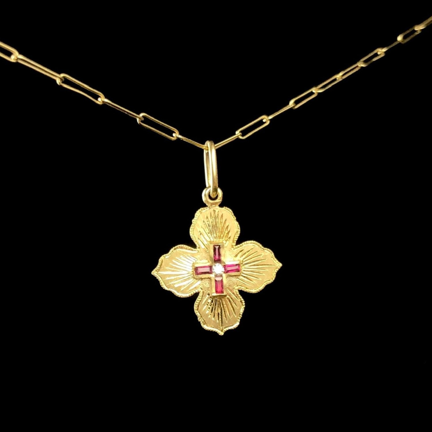 Front side of Ruby Clover Pendant with red Cross in gold flower design