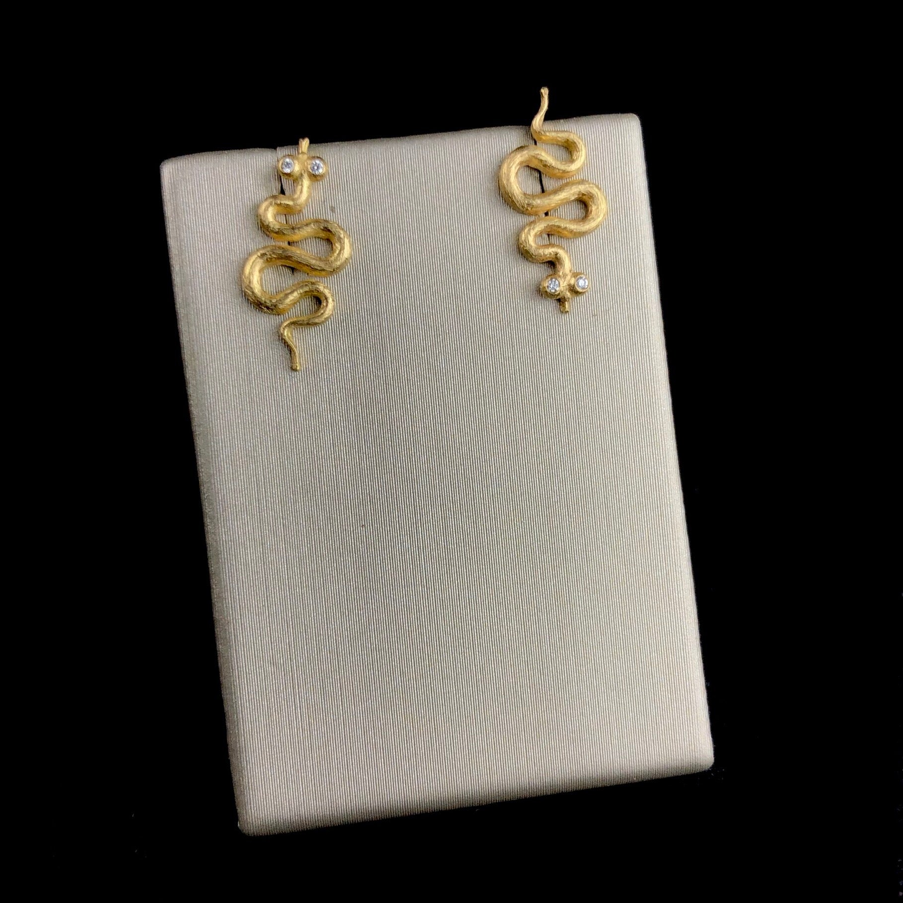 Front view of Snake Stud Earrings