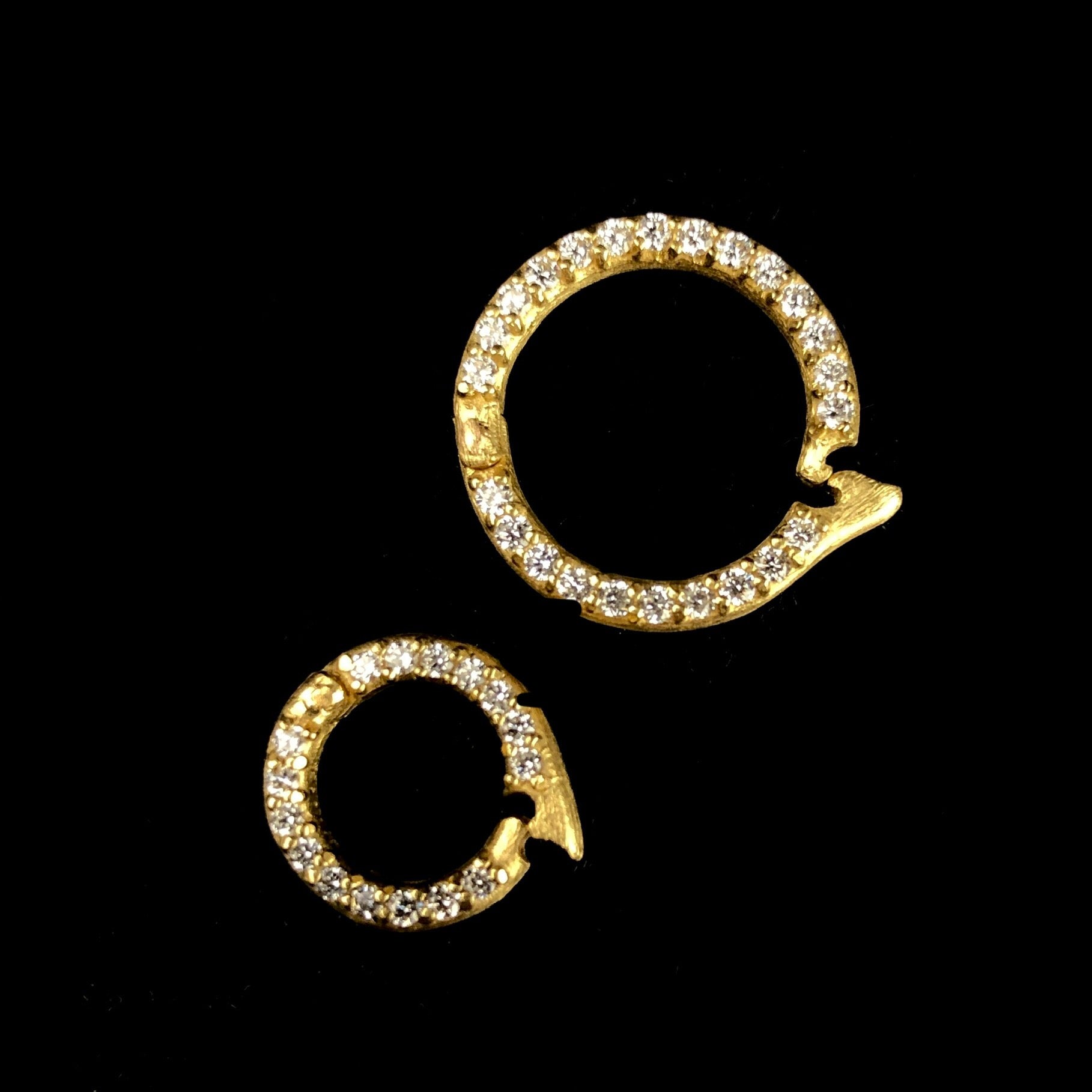 Two White Diamond Pave Set Circular Charm Clasps side by side