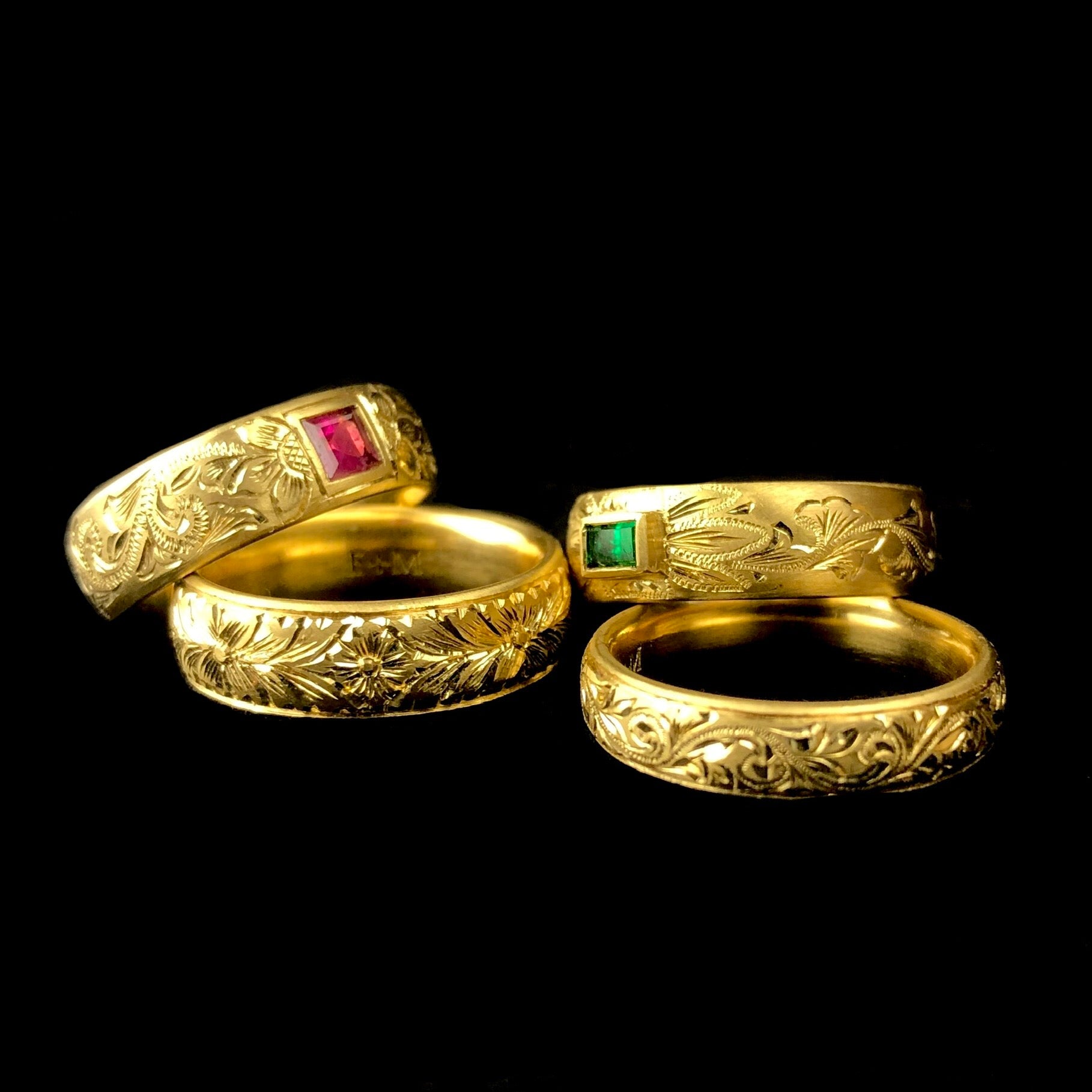 Ruby Ring shown on far right of image with three other similar gold bands