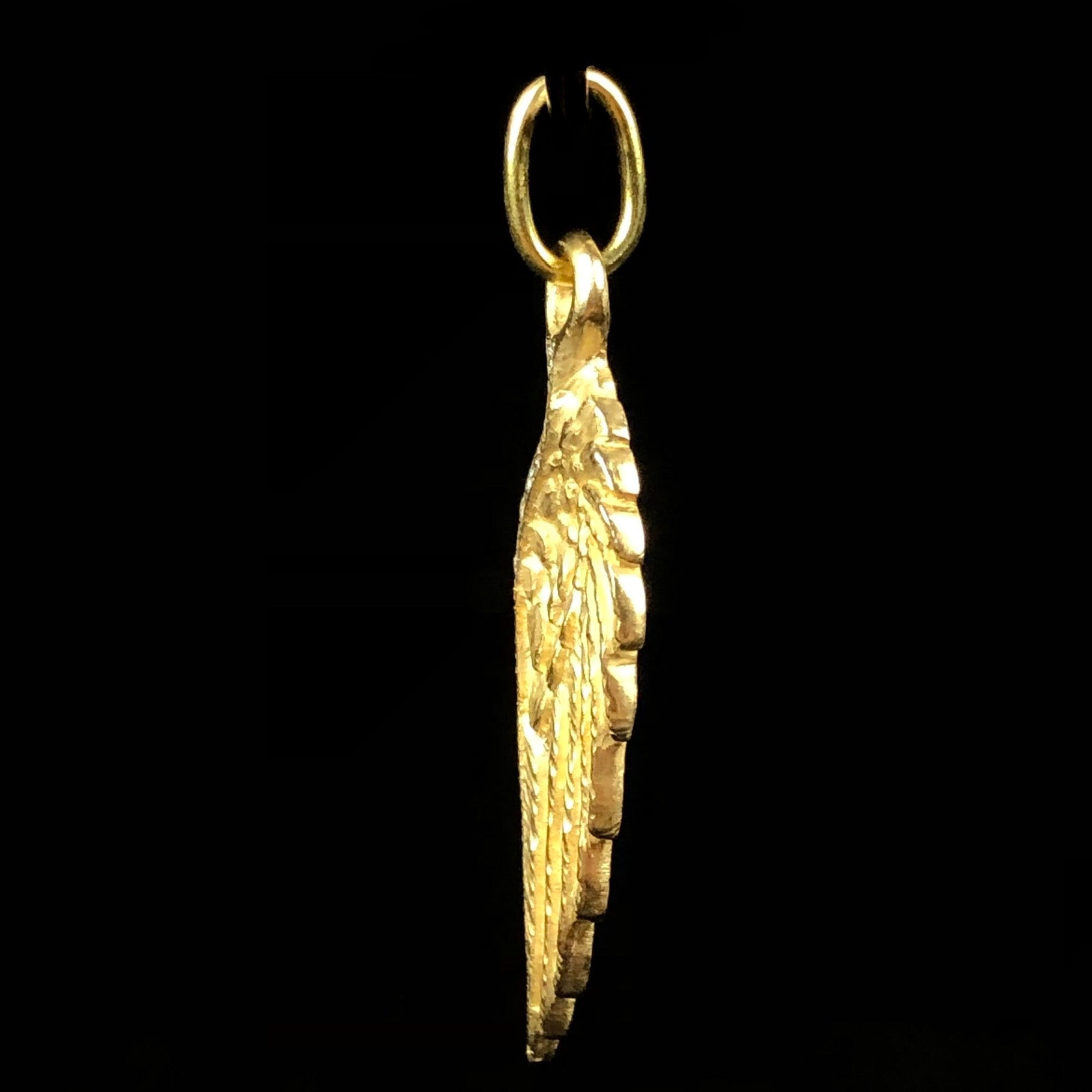 Side profile view of Gold & Diamond Wing Charm