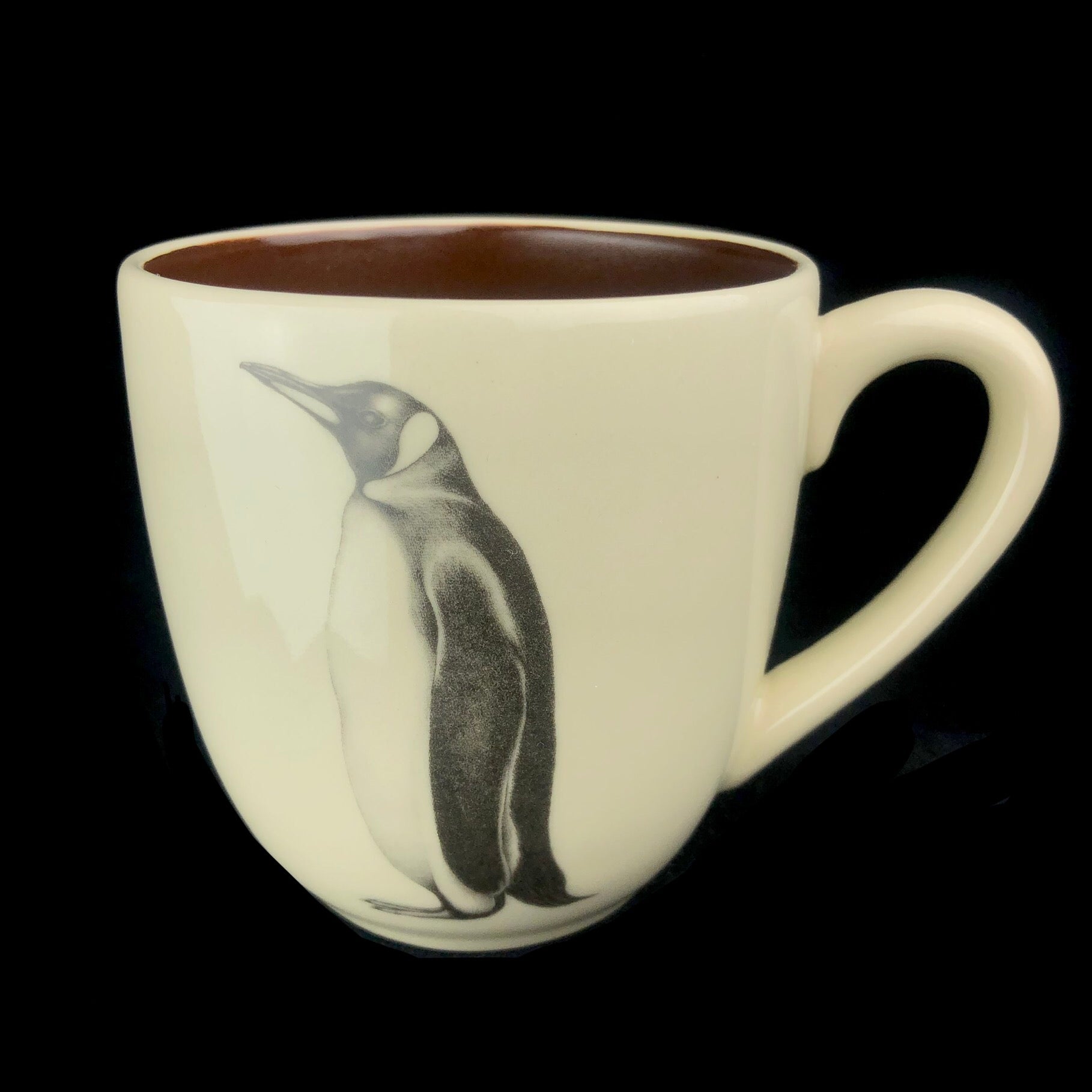 Cream colored mug with drawing of Penguin Bird