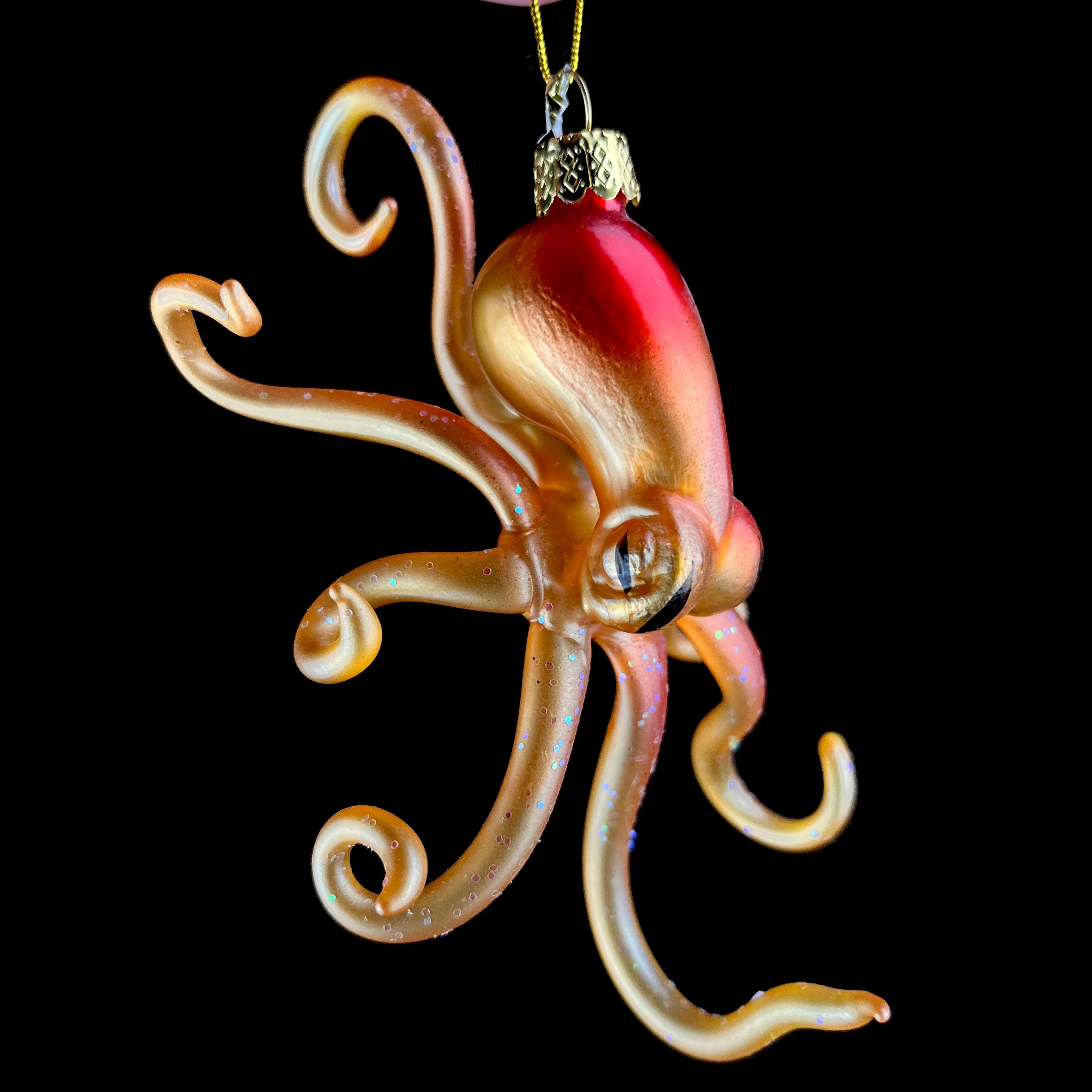 Orange and Red colored octopus with glittery arms