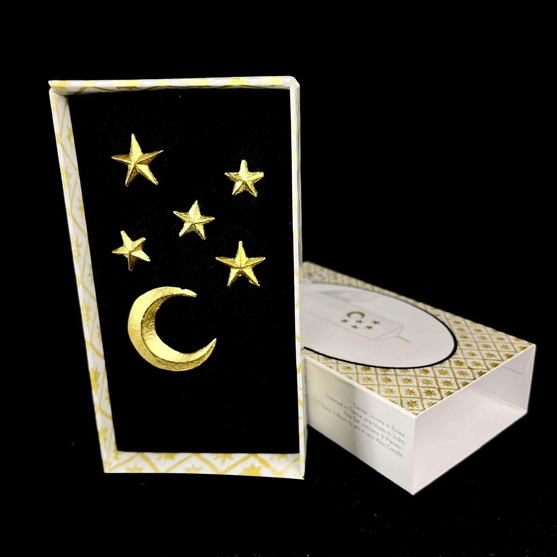 five stars and moon charms shown in box