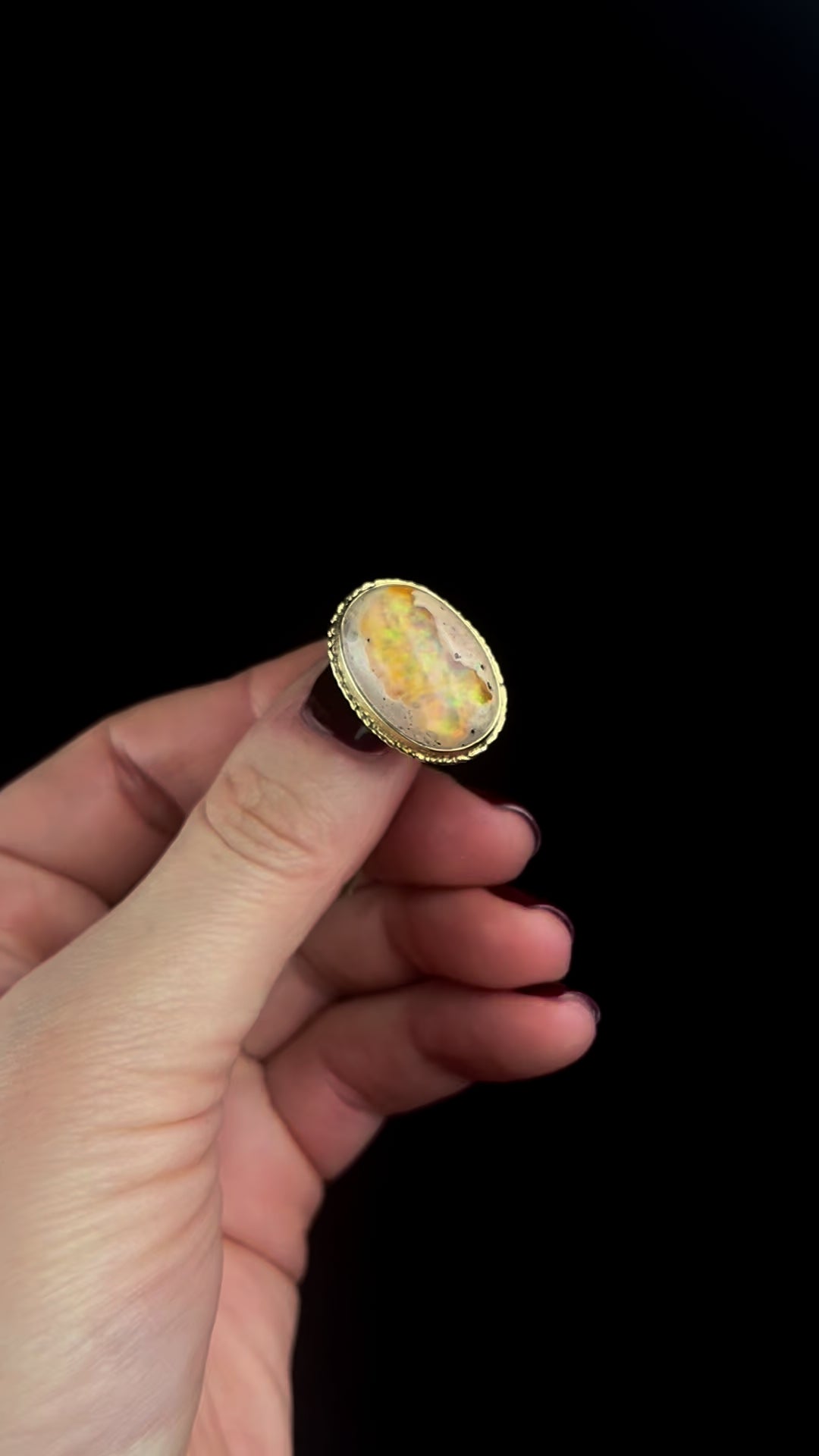 Gold Fire Opal Ring in motion 