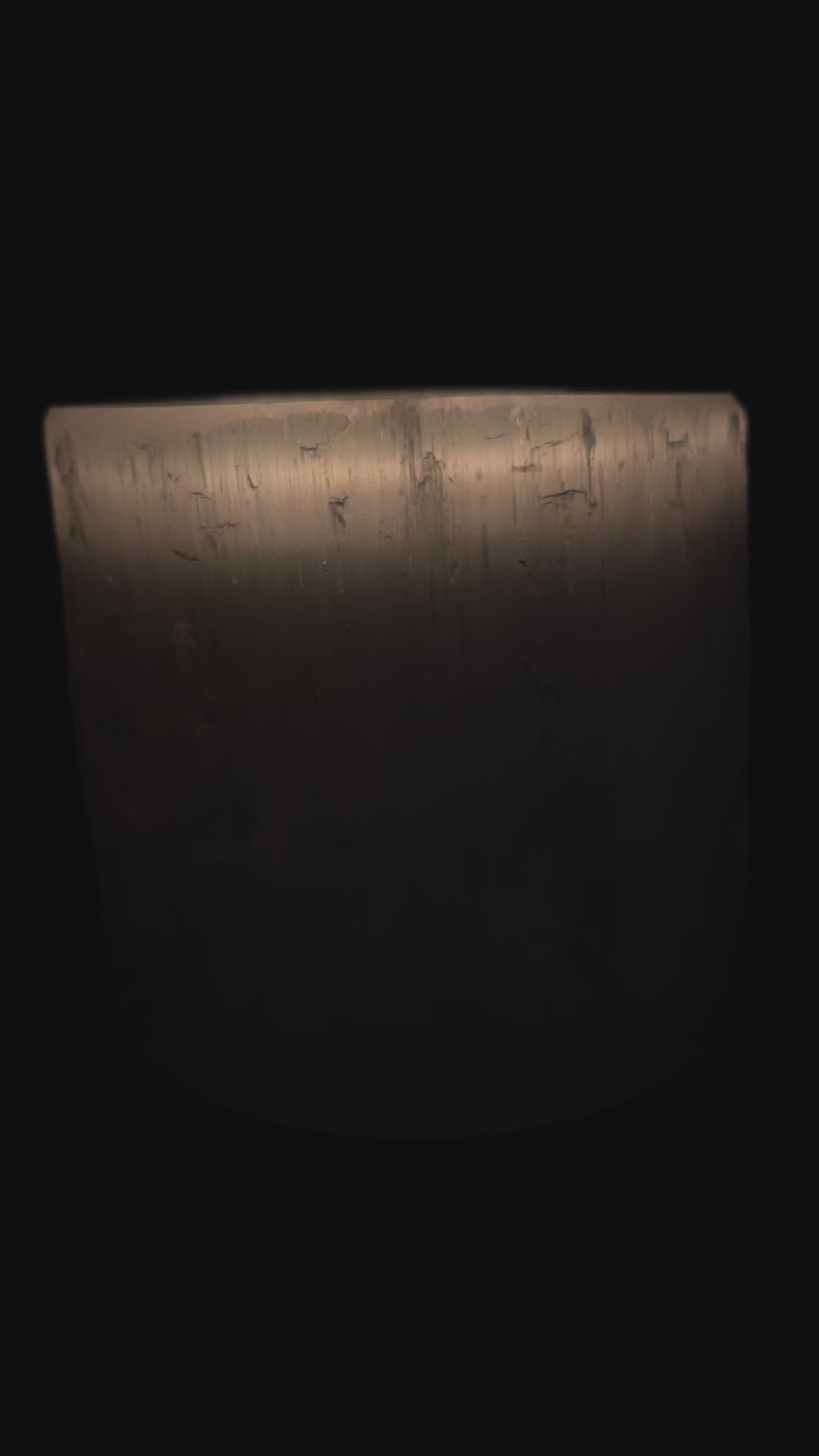 Selenite Candle Holder lit in the dark