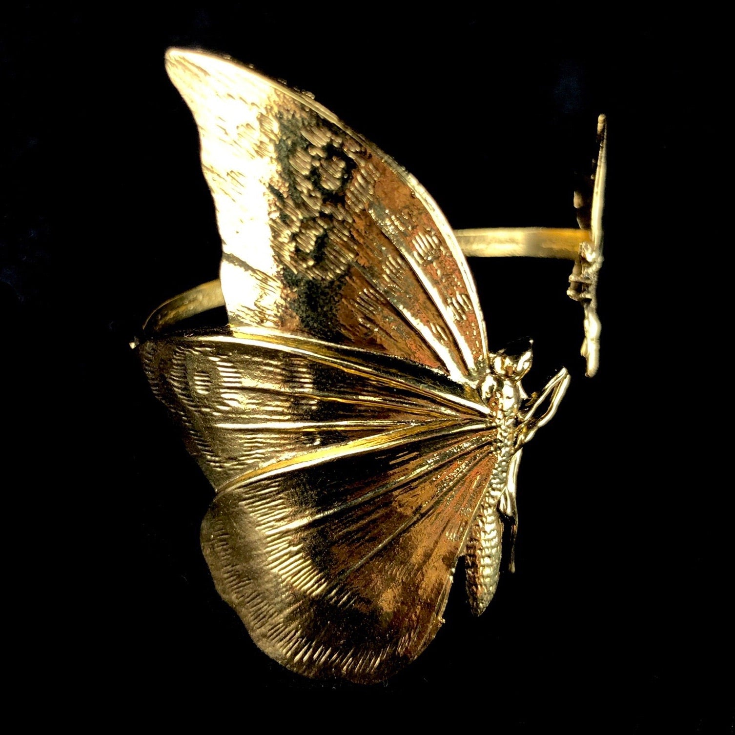 Side view of Gold Double Butterfly Cuff